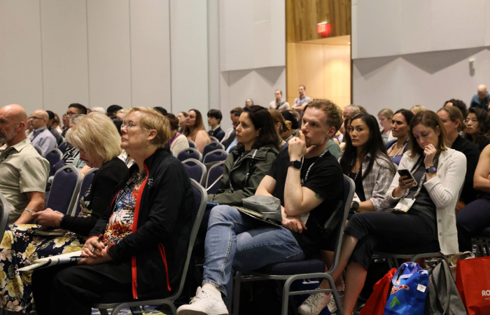 Attendees sitting at a session
