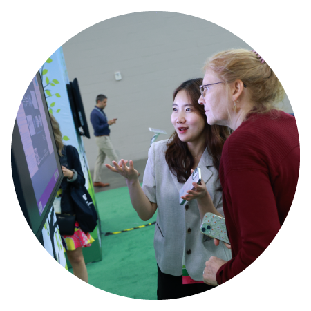 Two attendees discuss research at eposter park