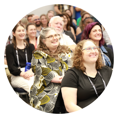 Audience laughing at presenter offscreen